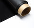 Musou Black Fineshut series ultra-black sheet unrolled from its core, showing the matte light-absorbing black material on a kraft paper tube
